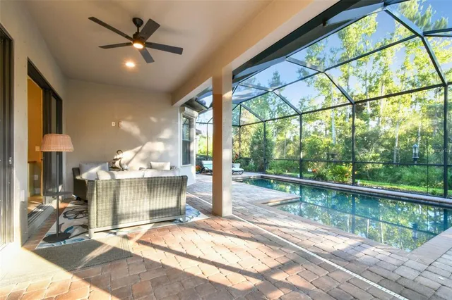 an aerial view of a residential houses with outdoor space and street view