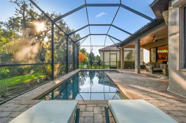 a front view of a house with a garden and a tree