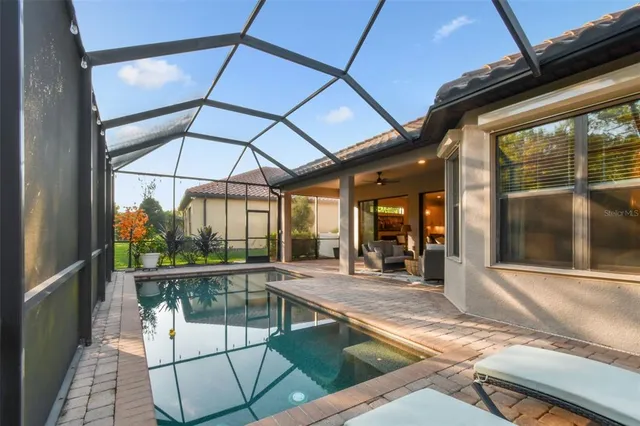 a view of a room with gym equipment and large glass door