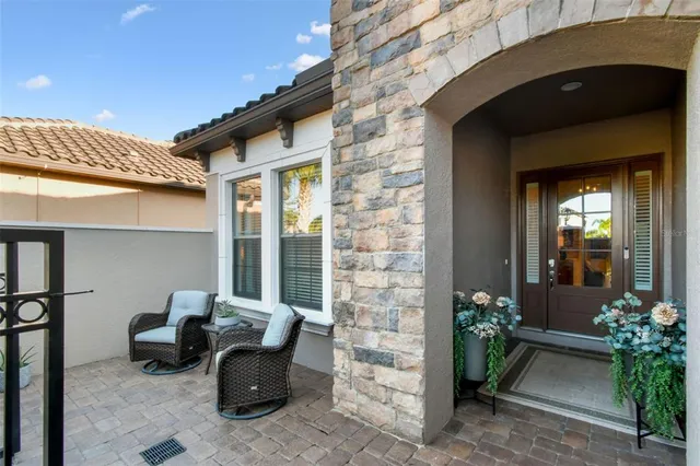 a large kitchen with stainless steel appliances granite countertop a lot of counter space and wooden floor