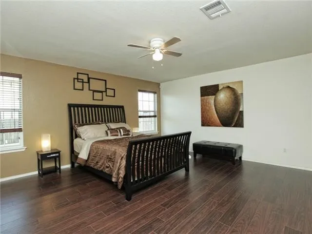 a bedroom with furniture and a window