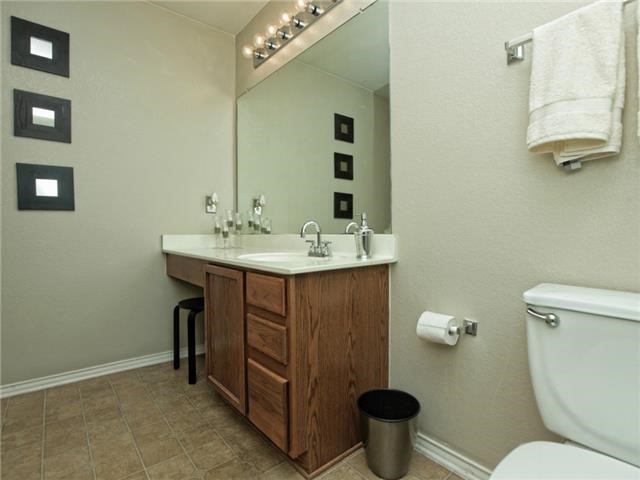 1008 Apollo Circle Round Rock, TX 78664 - Photo 24 of 33 a bathroom with a toilet sink and mirror