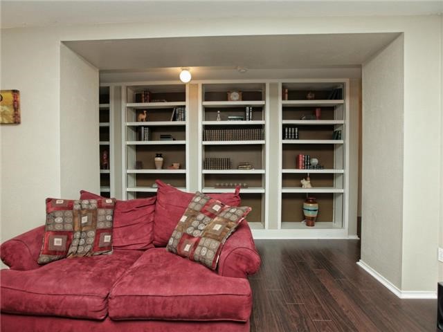 1008 Apollo Circle Round Rock, TX 78664 - Photo 7 of 33 a living room with furniture and a book shelf