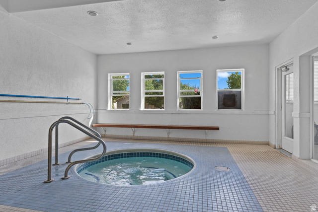 2990 East Riverside Drive, Unit 166 St. George, UT 84790 - Photo 18 of 22 View of pool with a hot tub