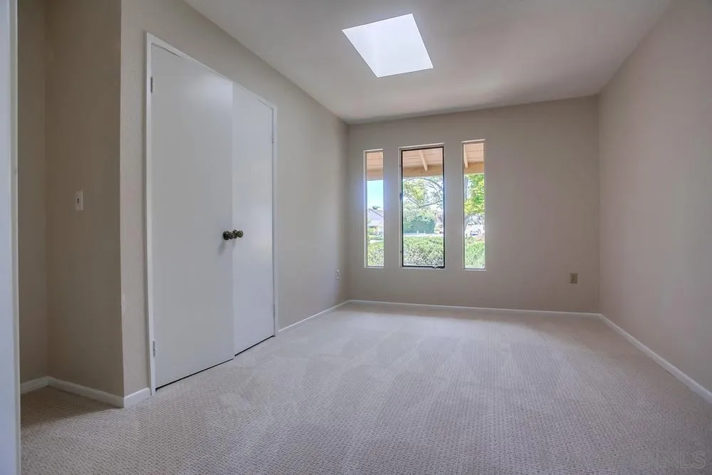 7114 Columbine Drive Carlsbad, CA 92011 - Photo 13 of 16 an empty room with windows and closet