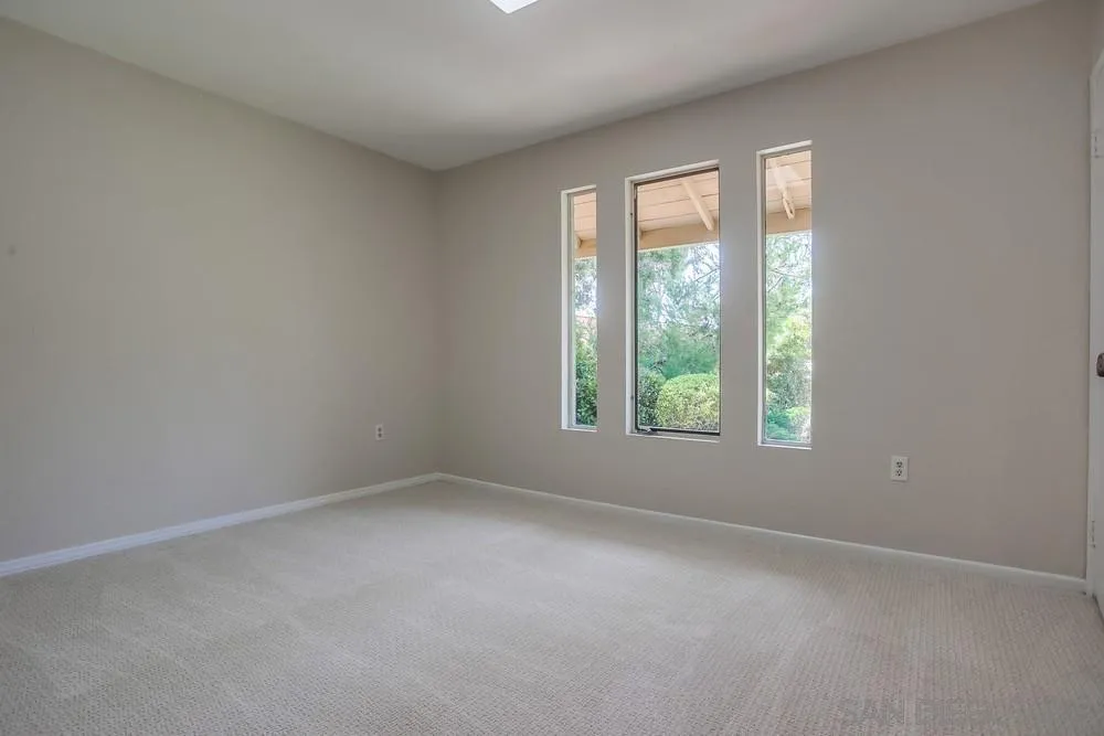 7114 Columbine Drive Carlsbad, CA 92011 - Photo 14 of 16 an empty room with a window