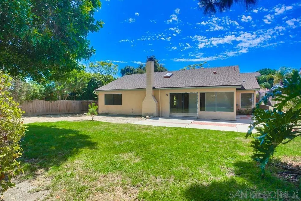 7114 Columbine Drive Carlsbad, CA 92011 - Photo 3 of 16 a front view of a house with a yard