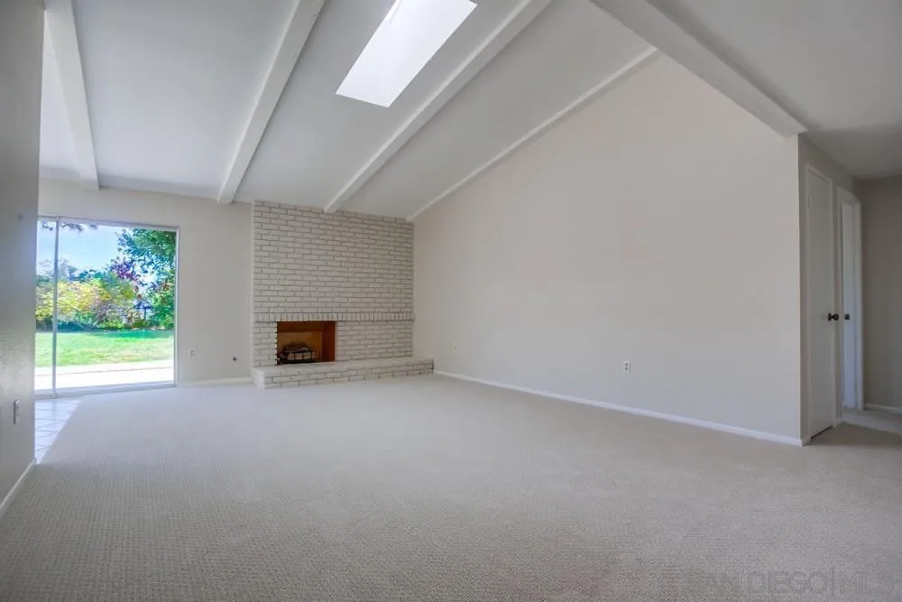 7114 Columbine Drive Carlsbad, CA 92011 - Photo 4 of 16 a view of an empty room with a window