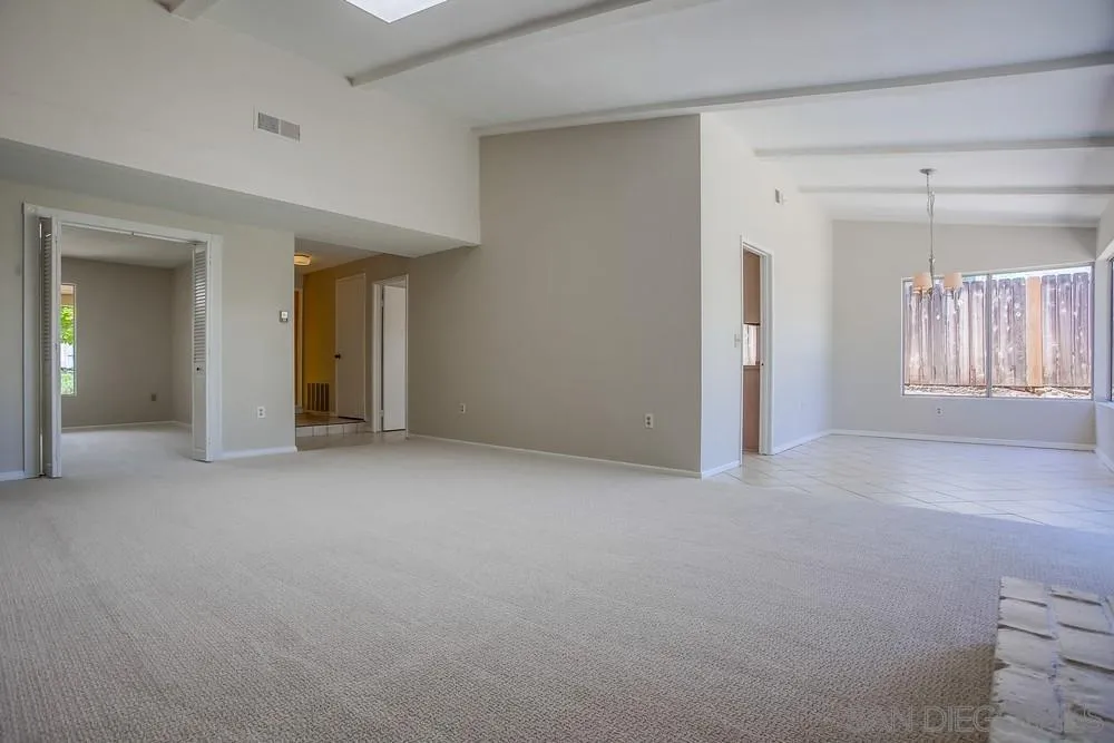 7114 Columbine Drive Carlsbad, CA 92011 - Photo 5 of 16 an empty room with windows and closet