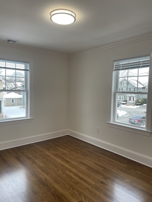 29 Crescent Road, Unit 29 Belmont, MA 02478 - Photo 11 of 21 an empty room with wooden floor and windows