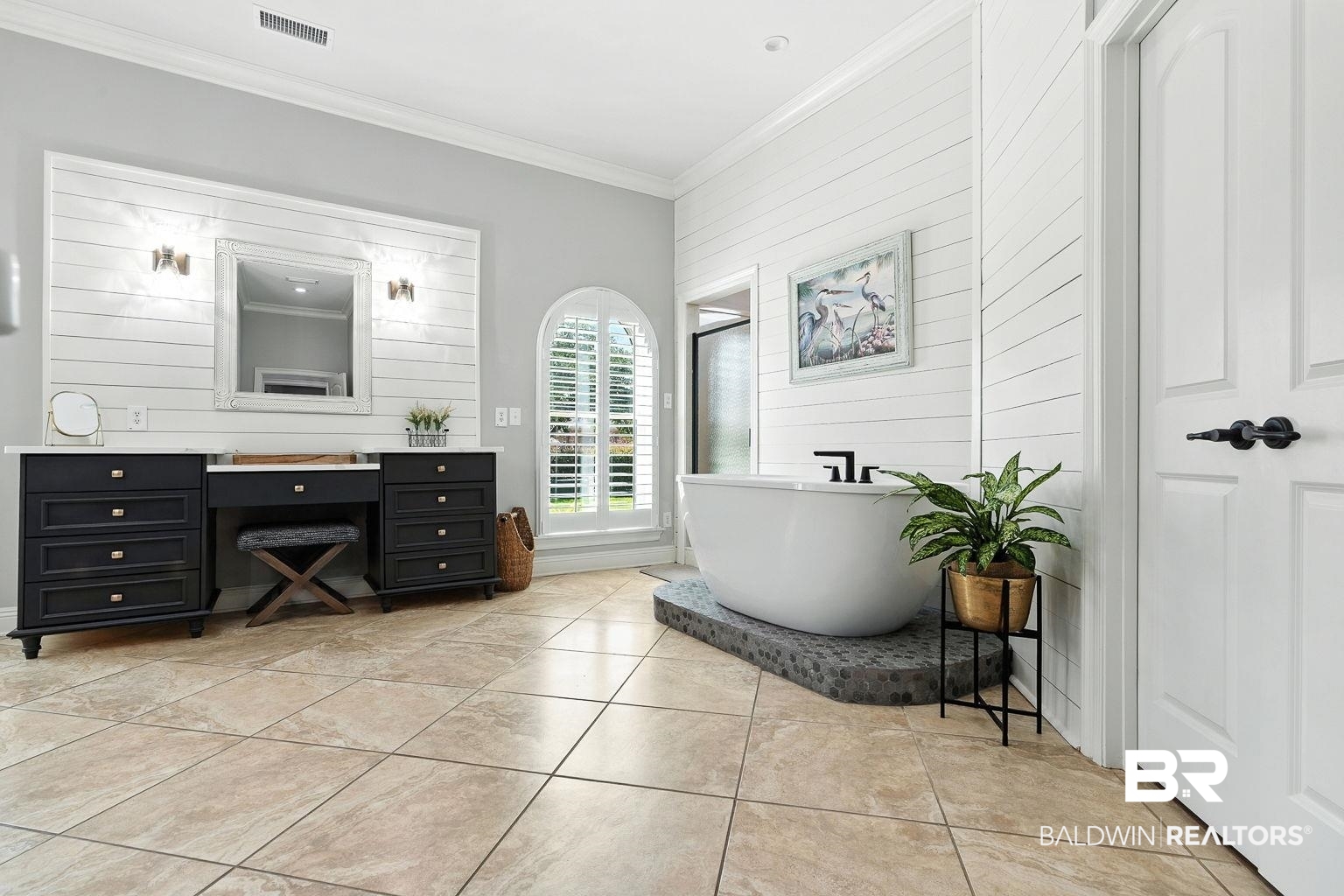23357 Carnoustie Drive Foley, AL 36535 - Photo 51 of 99 Full bathroom with wood walls, vanity, crown molding, a freestanding bath, and tile patterned flooring