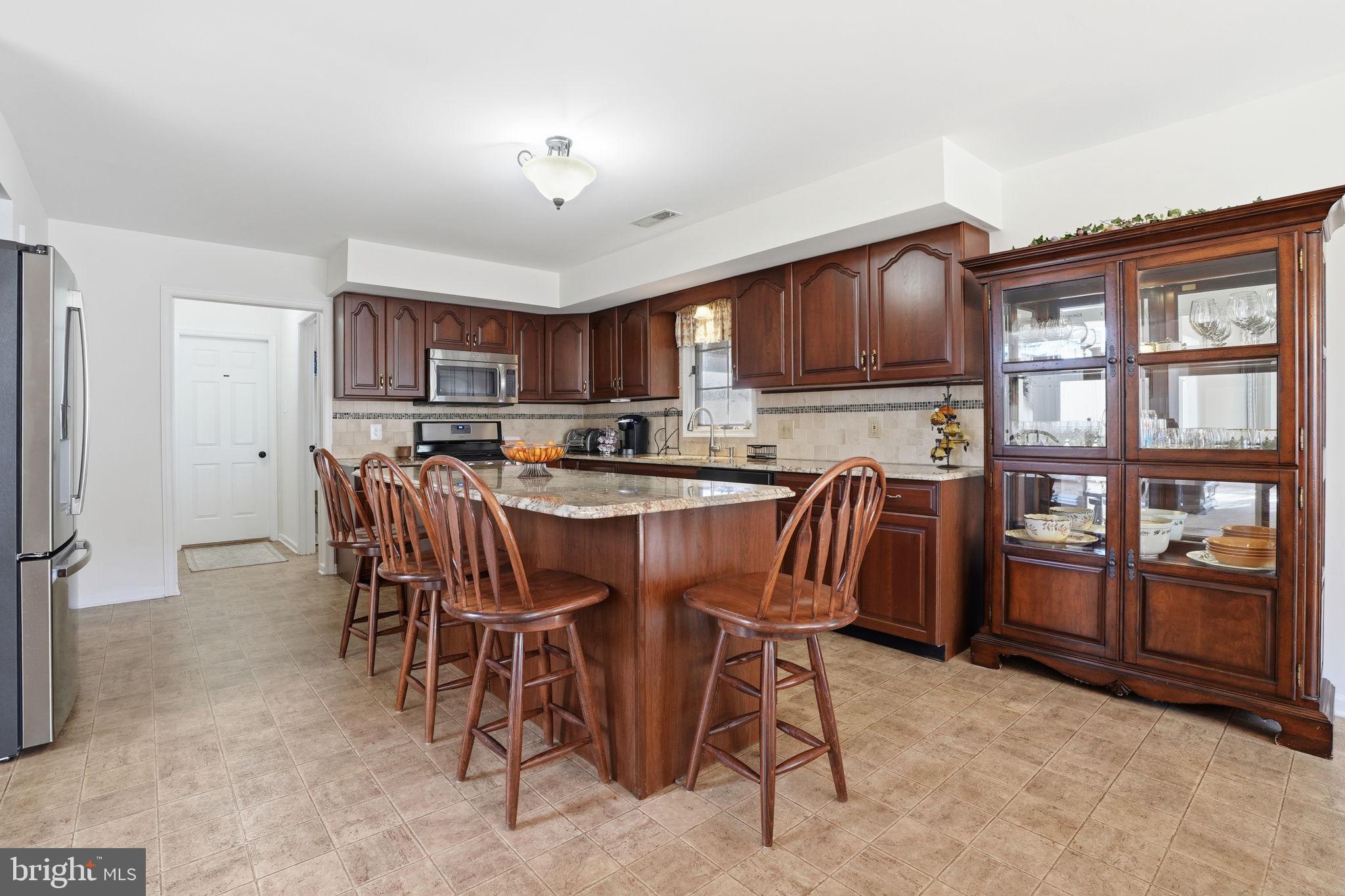 3 Swallow Road Holland, PA 18966 - Photo 13 of 45 a dining room with furniture a window and kitchen view