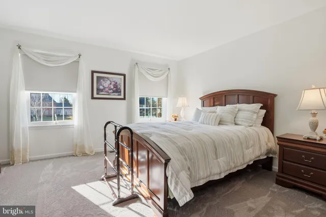 a bed room with a bed and a window