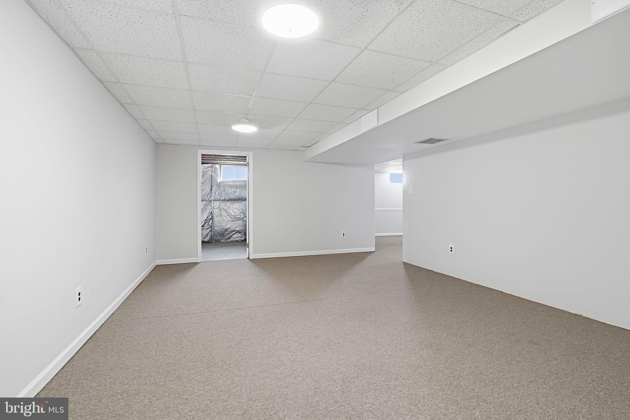 3 Swallow Road Holland, PA 18966 - Photo 37 of 45 a view of an empty room with a kitchen