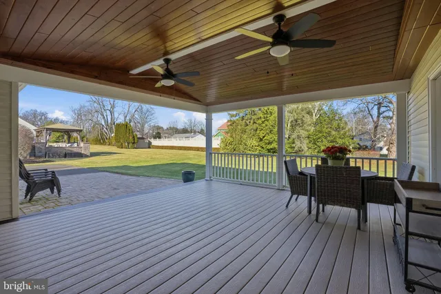 a view of a patio with a table chairs and a patio