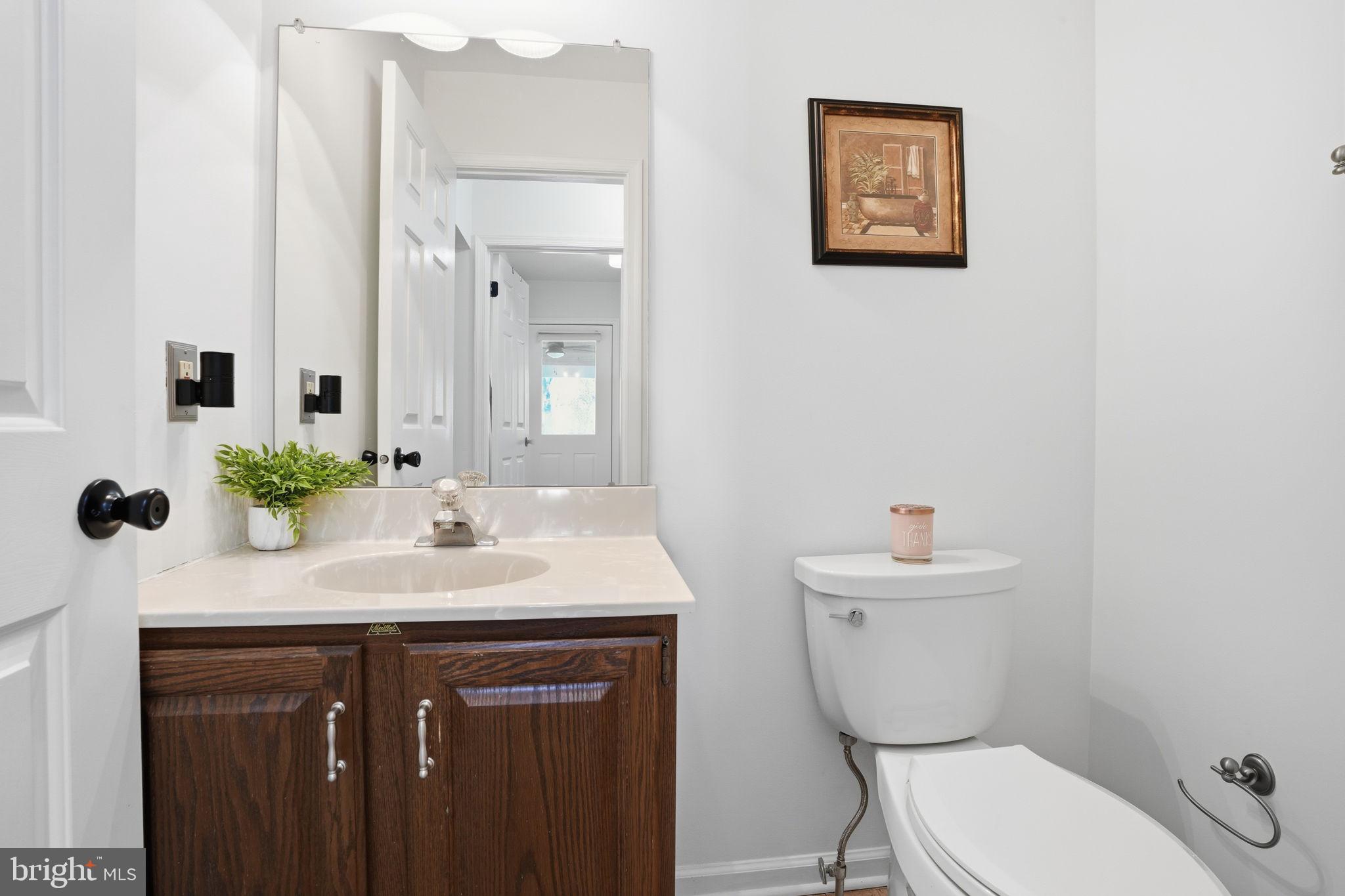 3 Swallow Road Holland, PA 18966 - Photo 7 of 45 a bathroom with a toilet sink and mirror