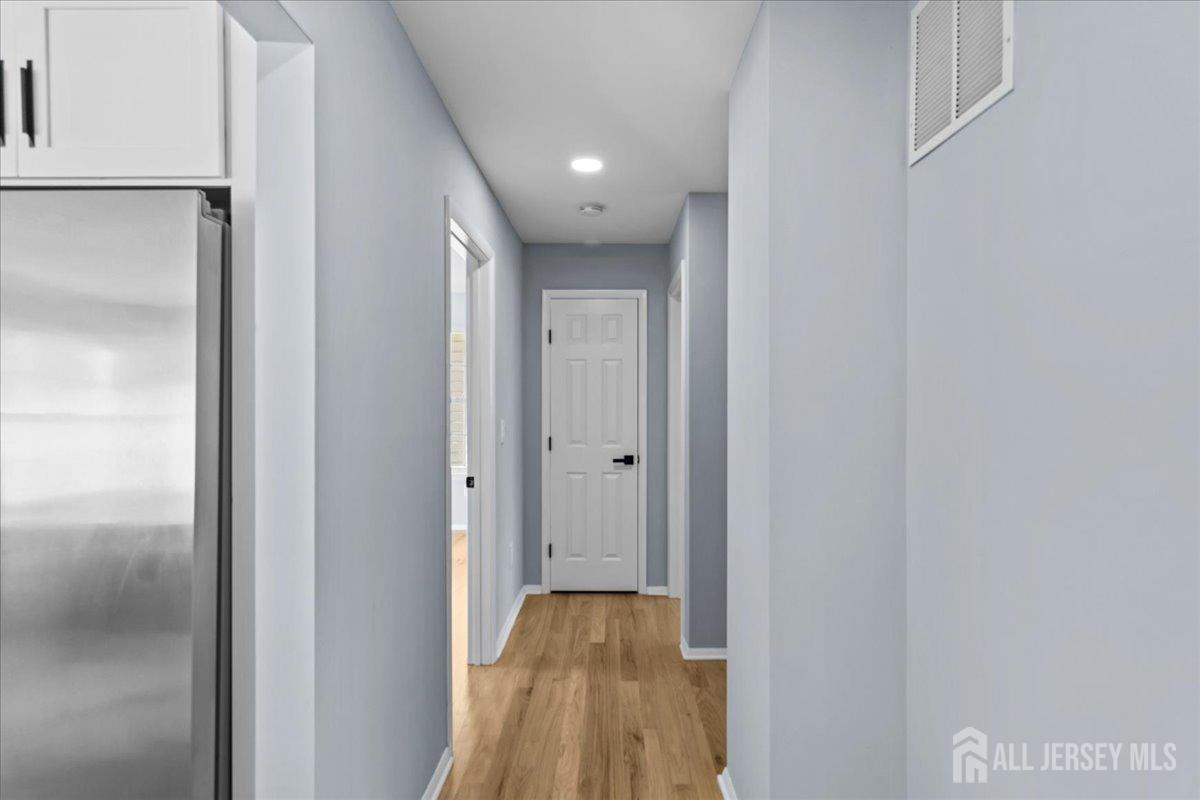 104 Maple Place Keyport, NJ 07735 - Photo 20 of 67 a view of hallway with wooden floor