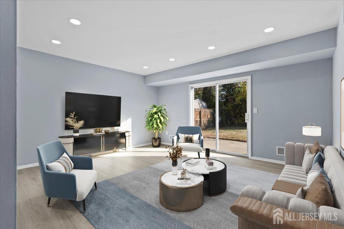 104 Maple Place Keyport, NJ 07735 - Photo 30 of 67 a living room with furniture and a flat screen tv