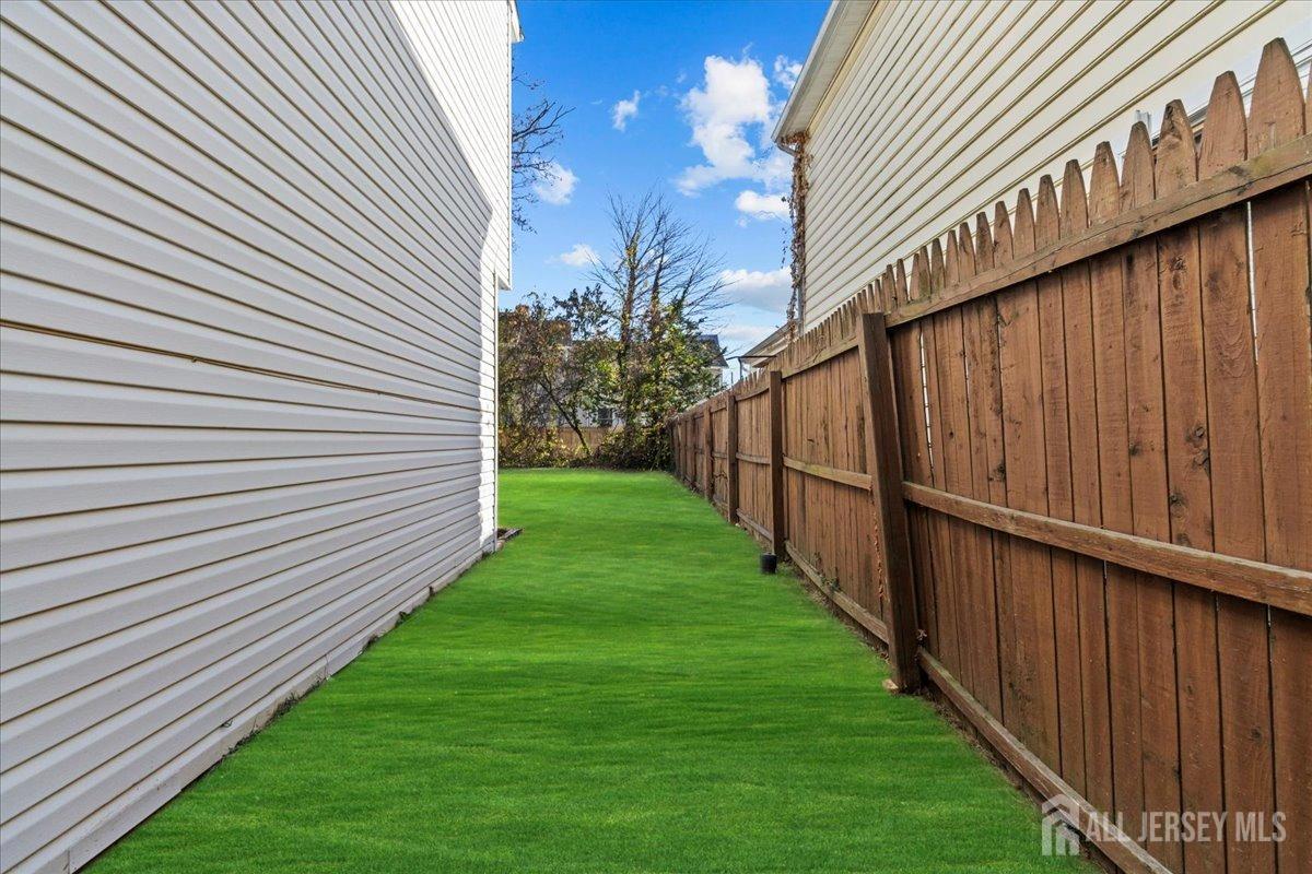 104 Maple Place Keyport, NJ 07735 - Photo 60 of 67 a view of a backyard with wooden fence