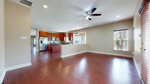 a view of a kitchen with a sink and a window