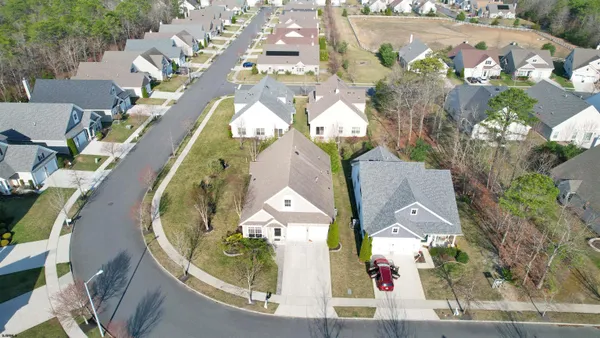 an aerial view of a house with a swimming pool
