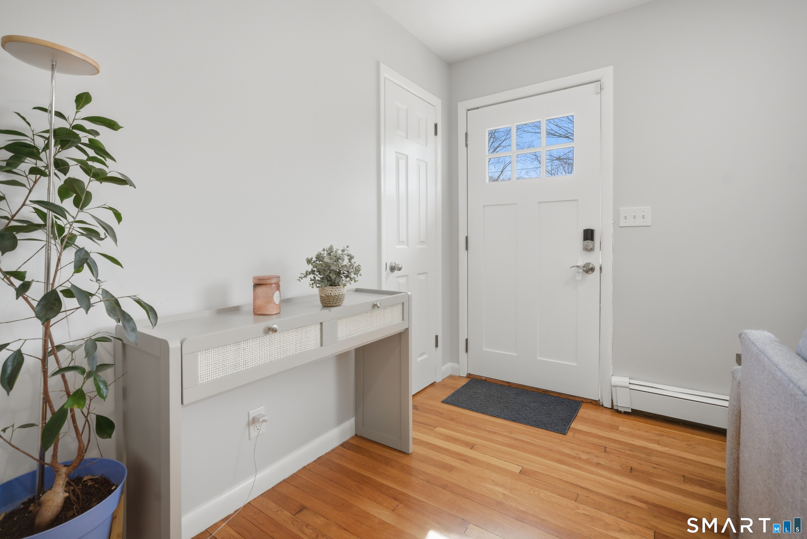96 Toll House Lane Fairfield, CT 06825 - Photo 2 of 29 a view of an entryway with wooden floor