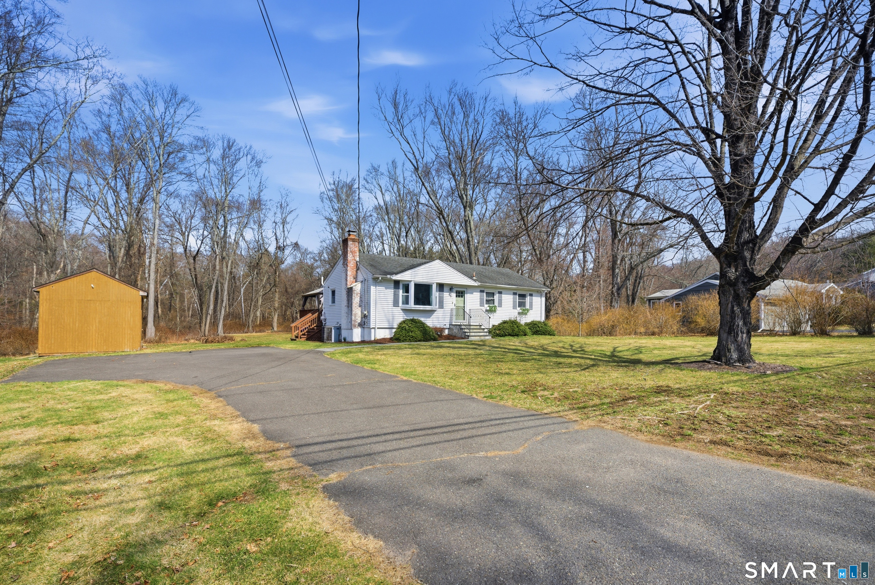 96 Toll House Lane Fairfield, CT 06825 - Photo 29 of 29 a view of a house with a yard and large trees