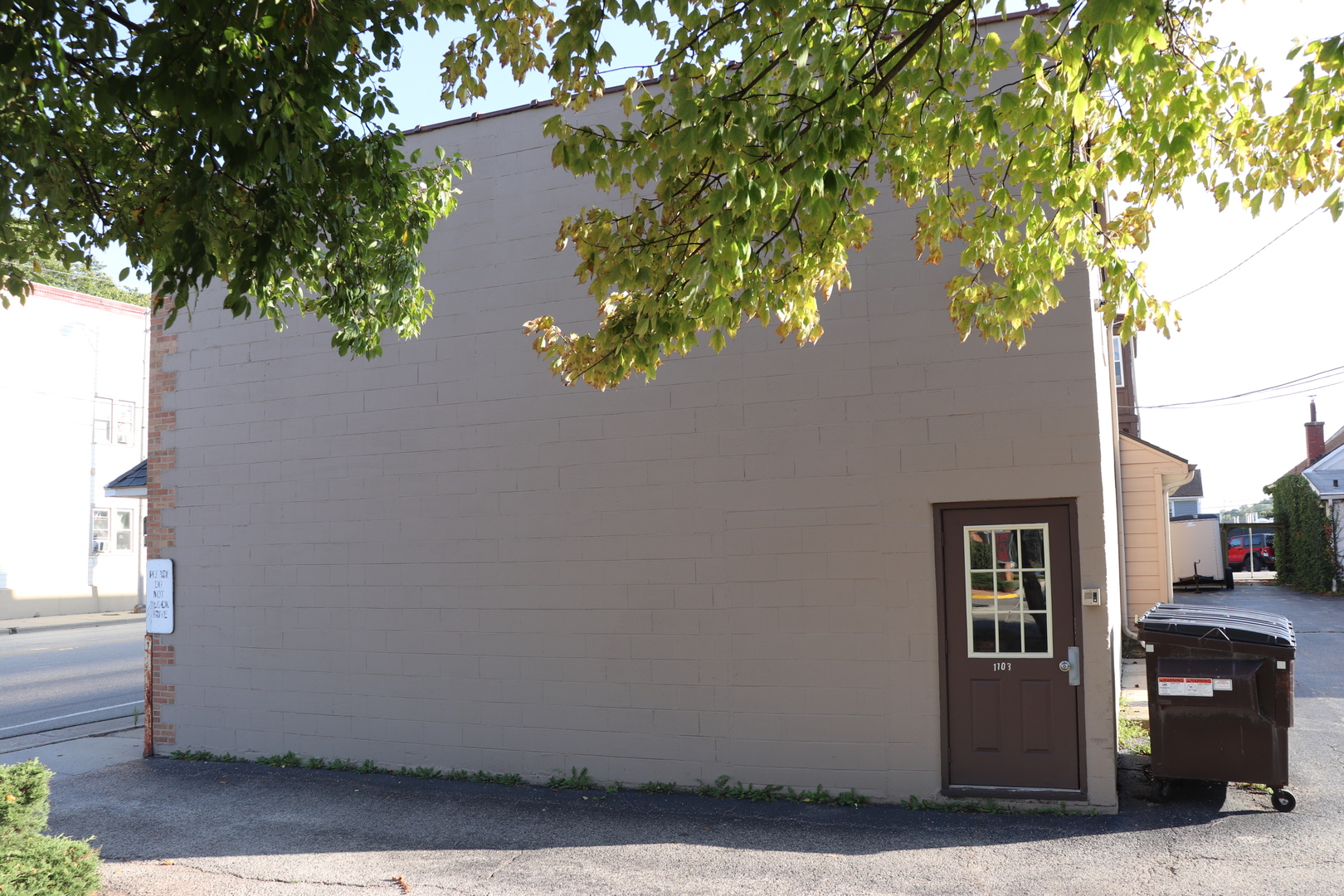 a view of a house with a tree