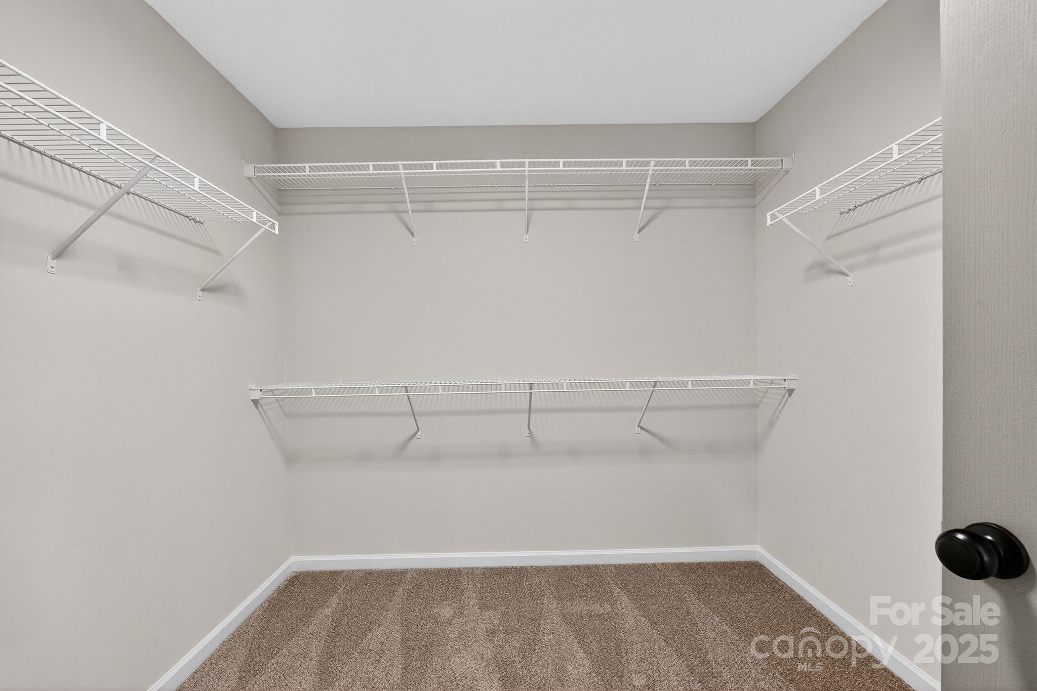 11227 Suunto Lane Cornelius, NC 28031 - Photo 12 of 20 a view of a room with racks on the wall