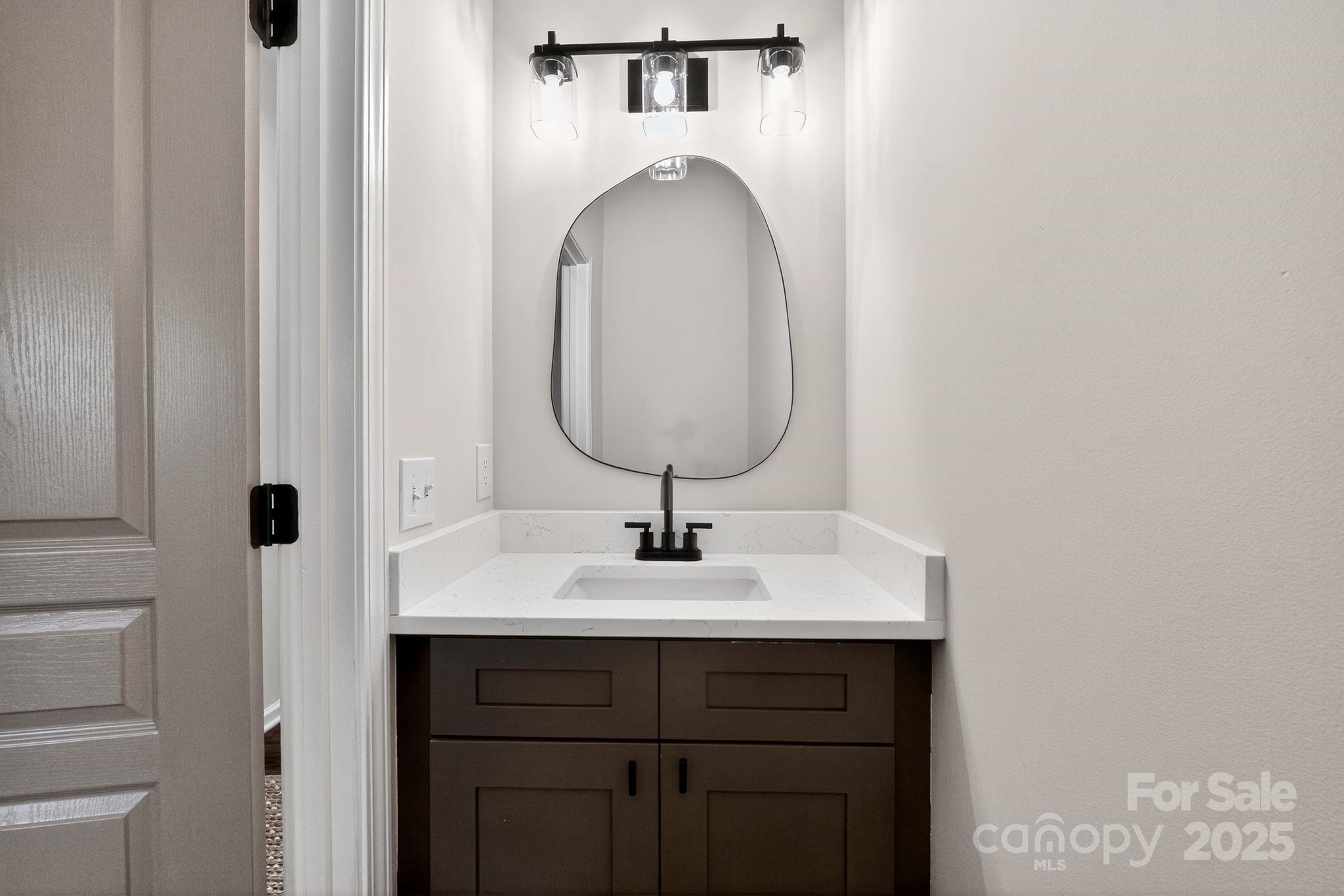 11227 Suunto Lane Cornelius, NC 28031 - Photo 16 of 20 a bathroom with a sink and a mirror