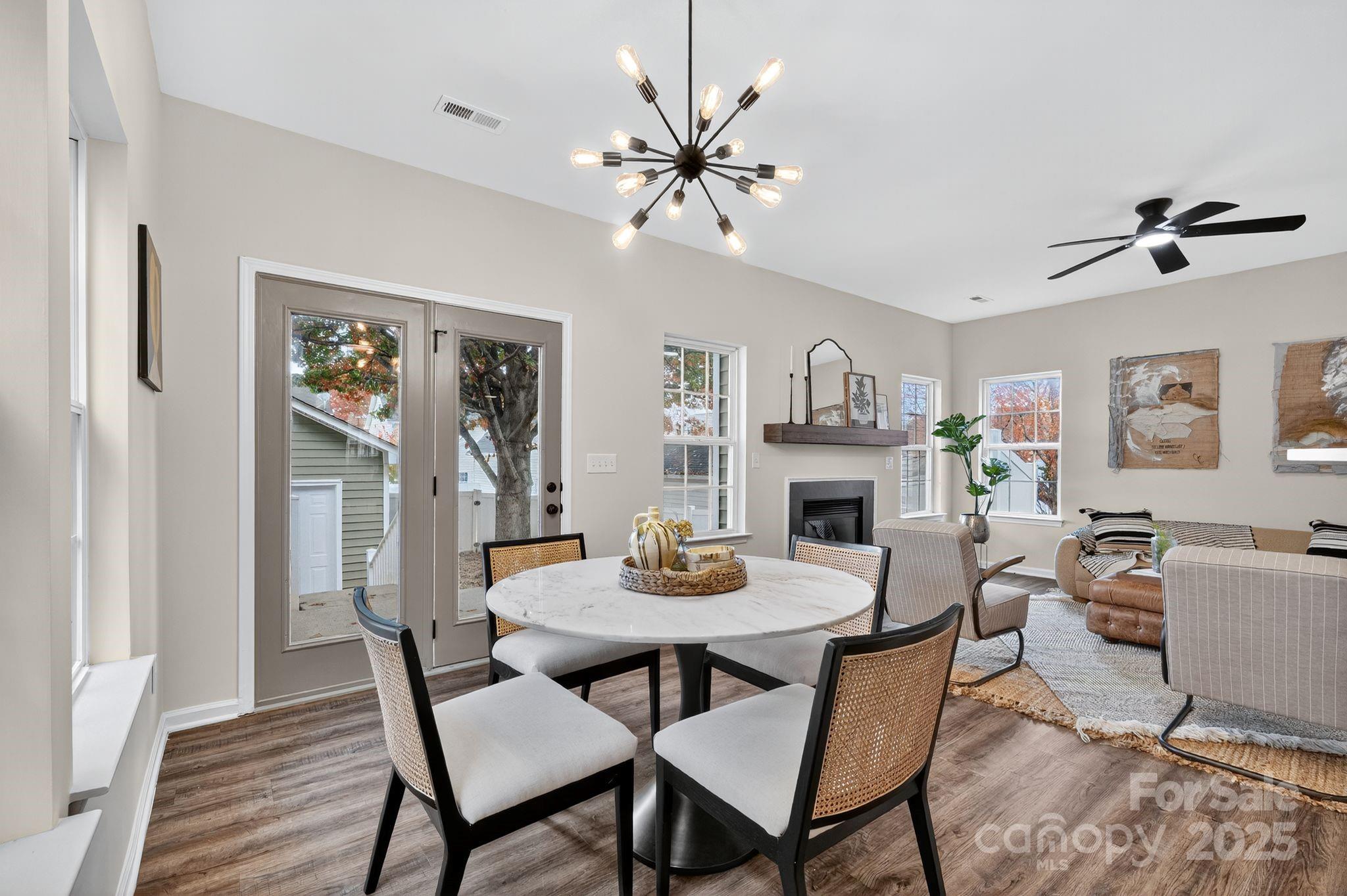 11227 Suunto Lane Cornelius, NC 28031 - Photo 7 of 20 a view of a dining room with furniture and wooden floor