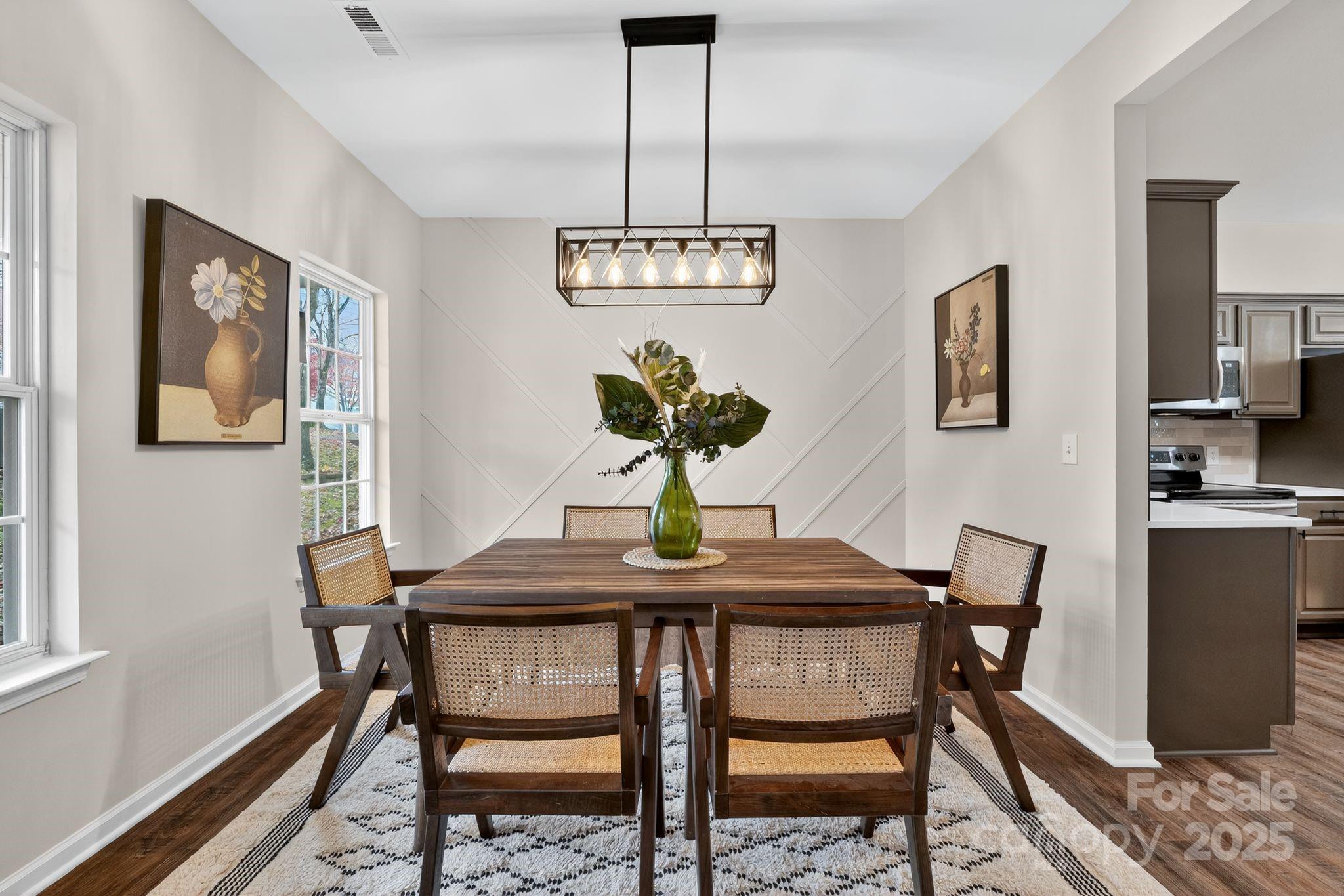 11227 Suunto Lane Cornelius, NC 28031 - Photo 8 of 20 a view of a dining room with a table and chairs