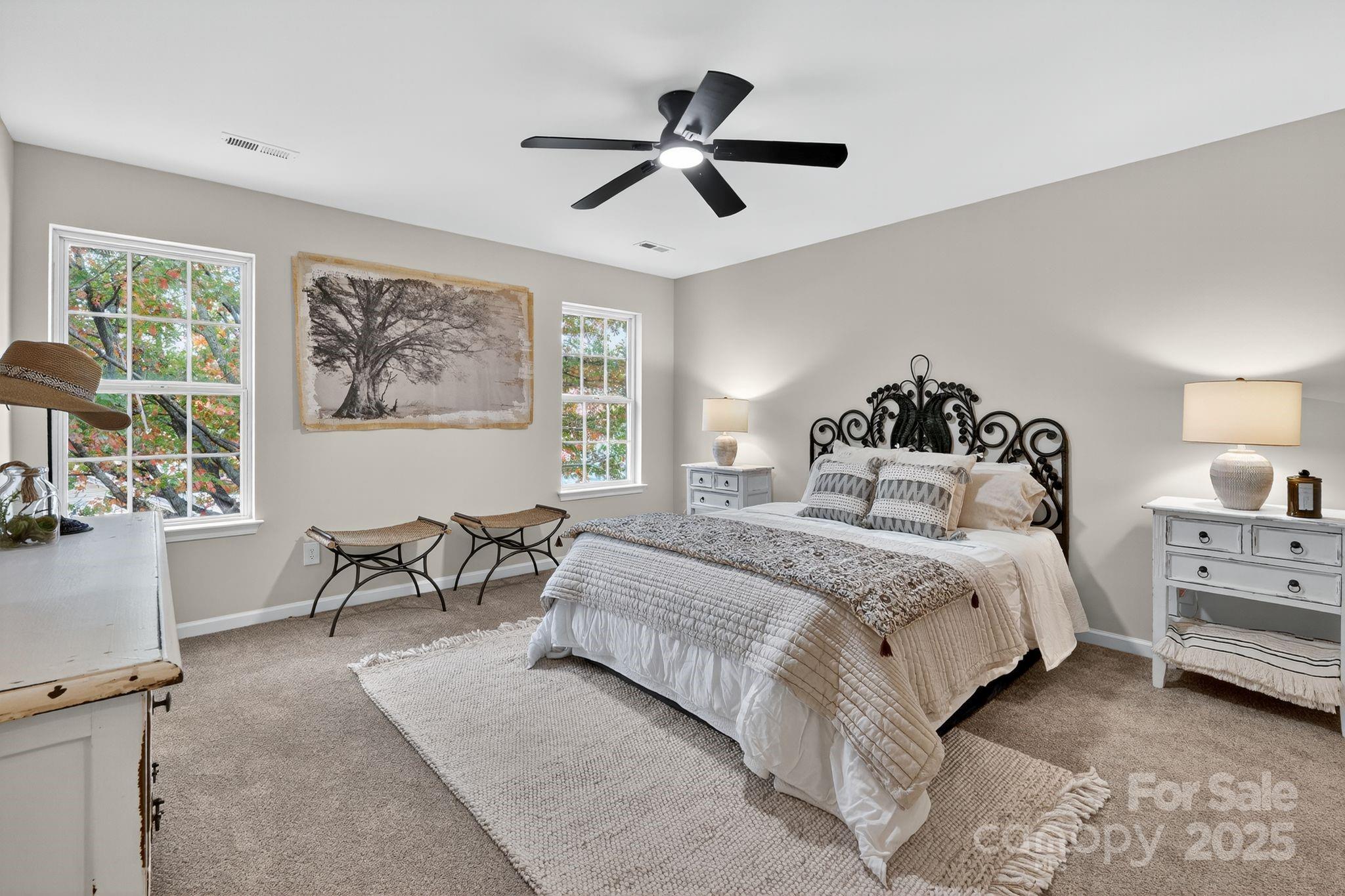 11227 Suunto Lane Cornelius, NC 28031 - Photo 9 of 20 a bedroom with a bed and wooden floor