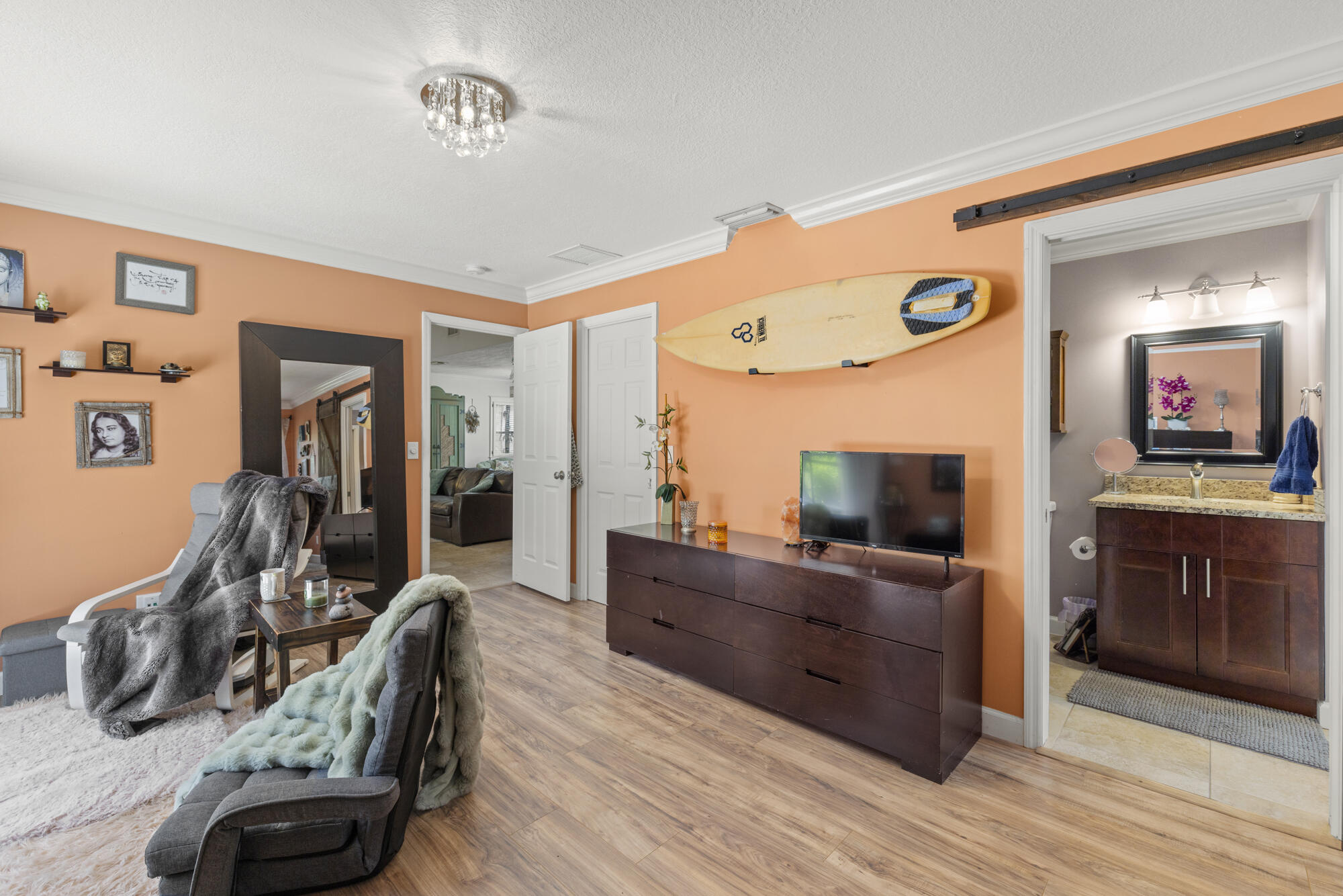 591 Kriss Lane Jupiter, FL 33458 - Photo 14 of 36 a living room with furniture and a flat screen tv