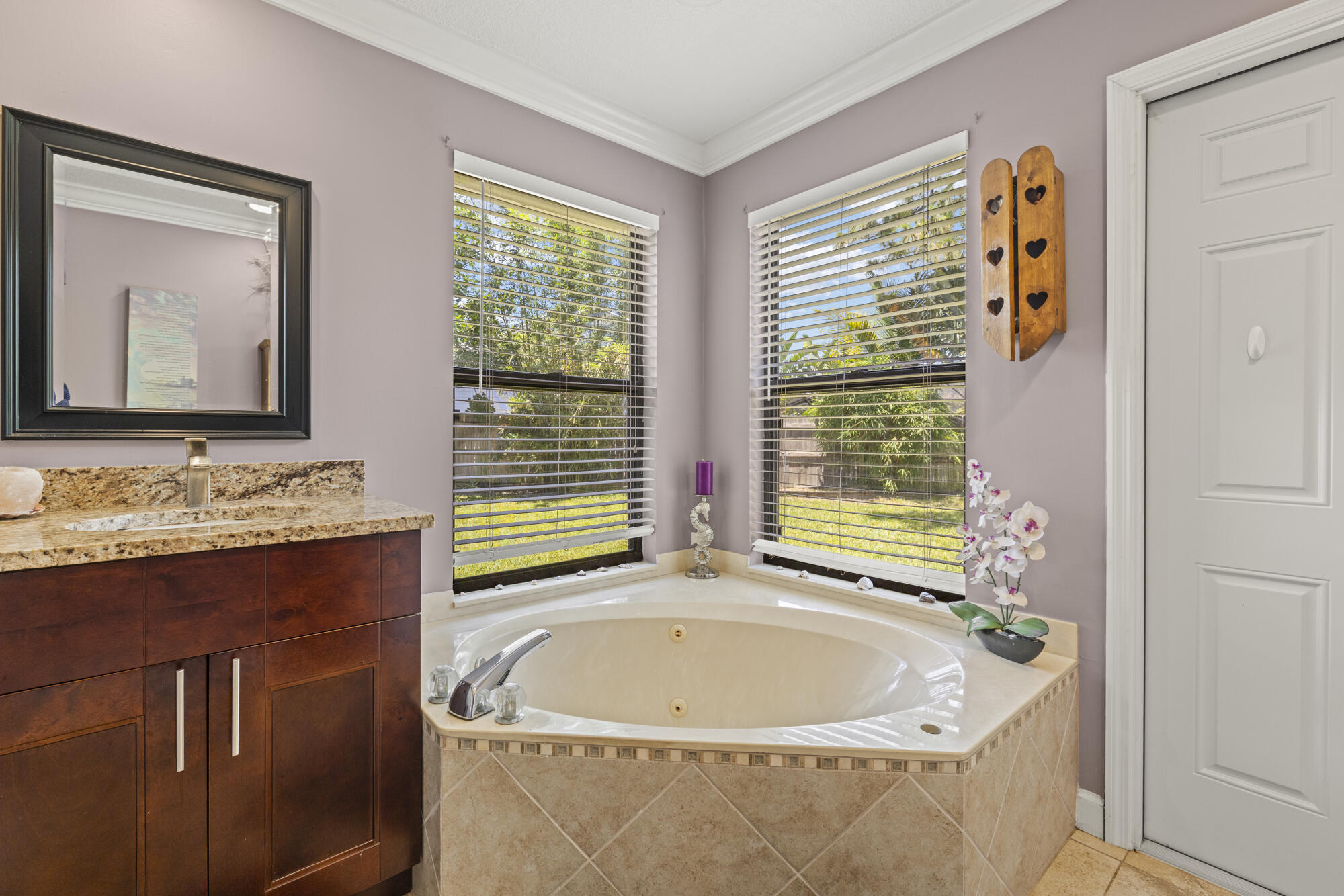591 Kriss Lane Jupiter, FL 33458 - Photo 16 of 36 a bath tub sitting next to a window