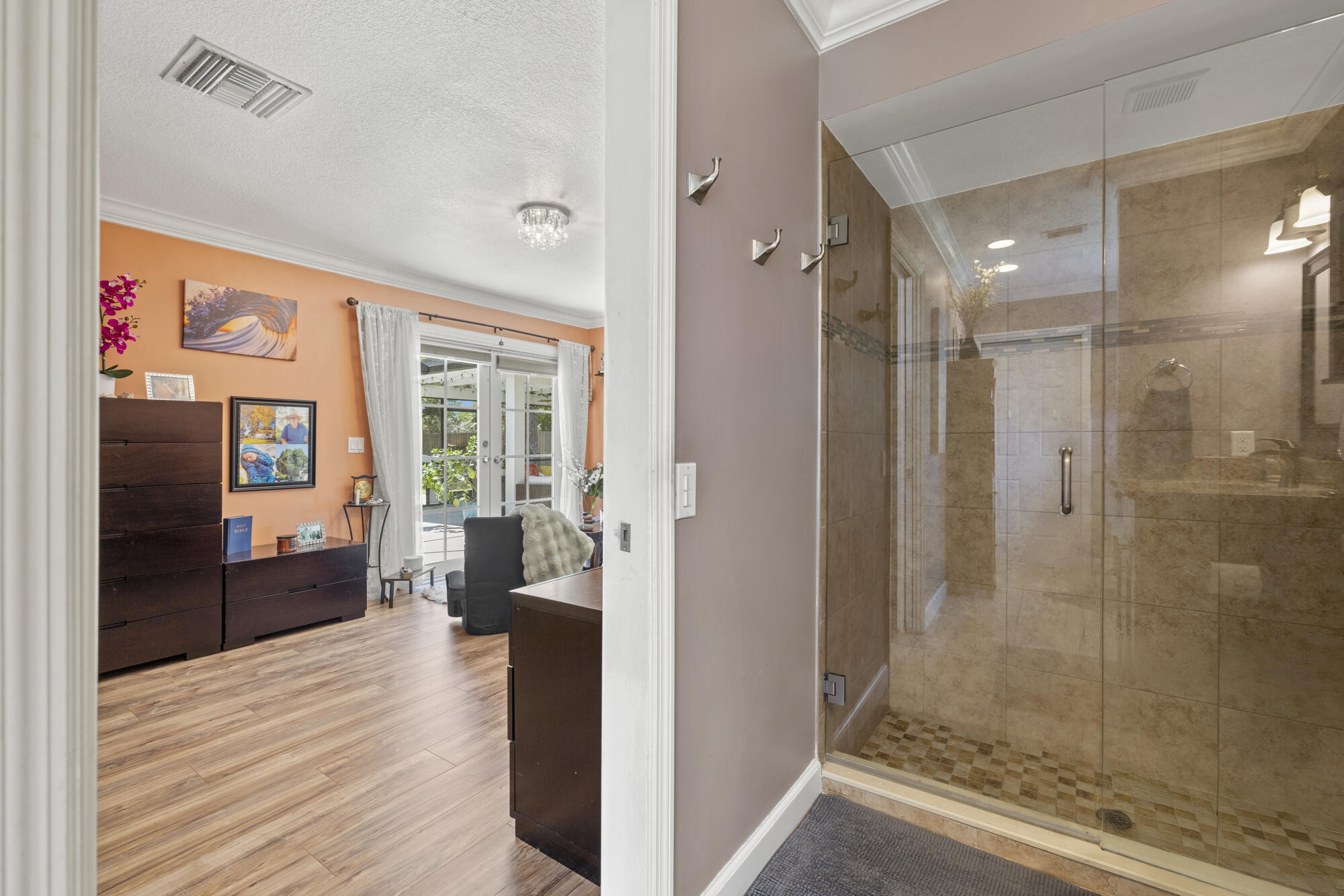 591 Kriss Lane Jupiter, FL 33458 - Photo 17 of 36 a view of a hallway with wooden floor and furniture