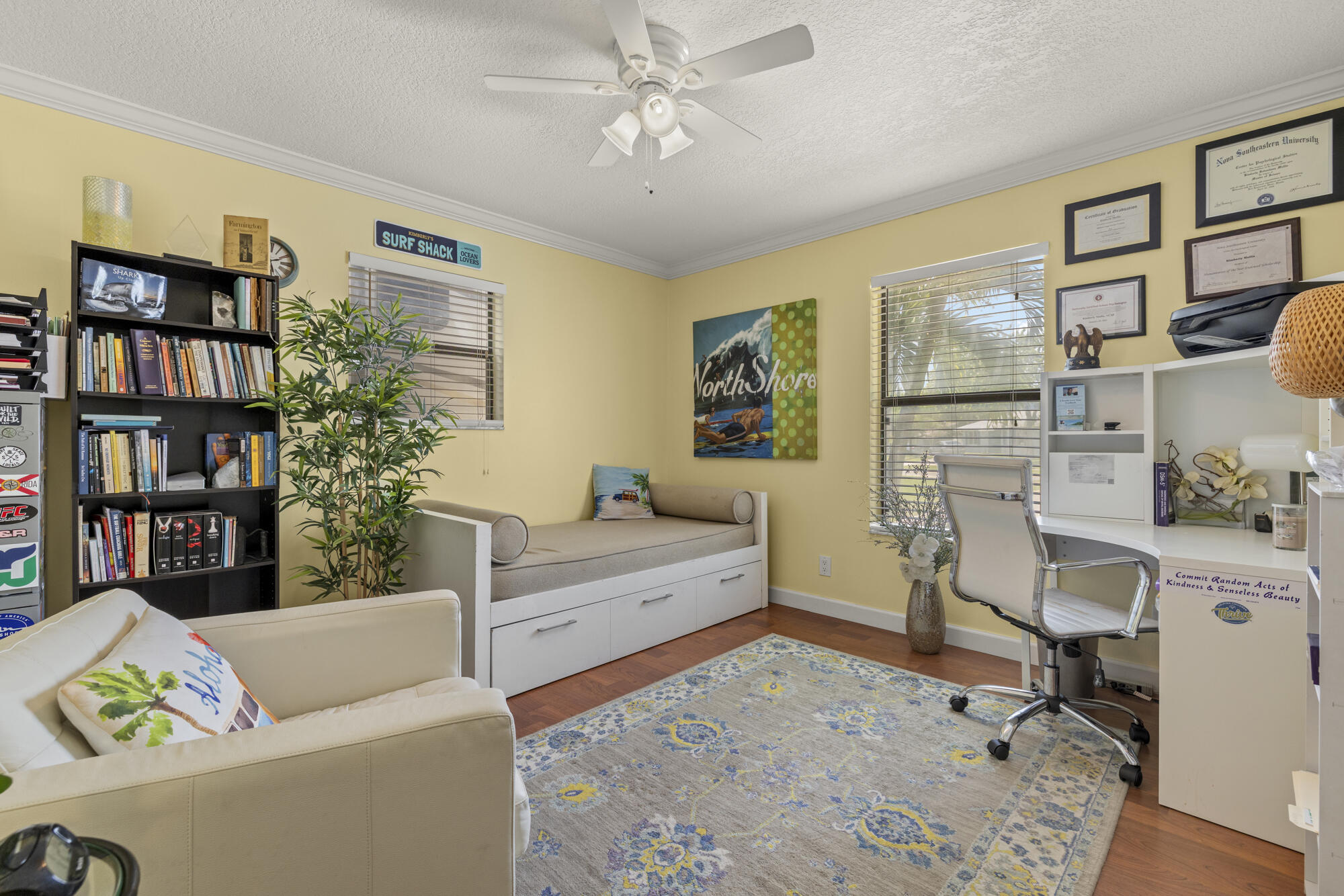 591 Kriss Lane Jupiter, FL 33458 - Photo 19 of 36 a living room with furniture and a book shelf