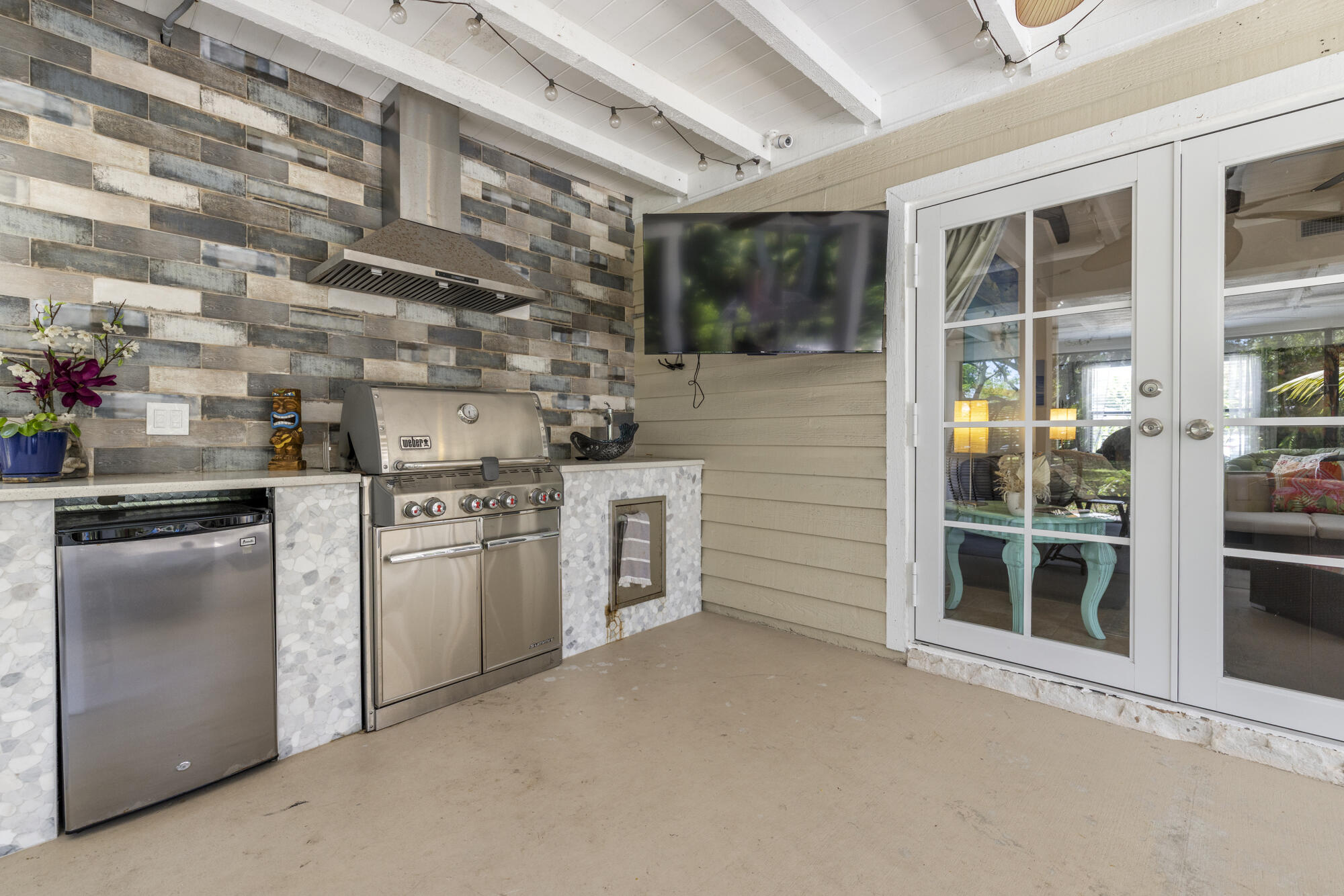 591 Kriss Lane Jupiter, FL 33458 - Photo 21 of 36 a kitchen with cabinets and stainless steel appliances