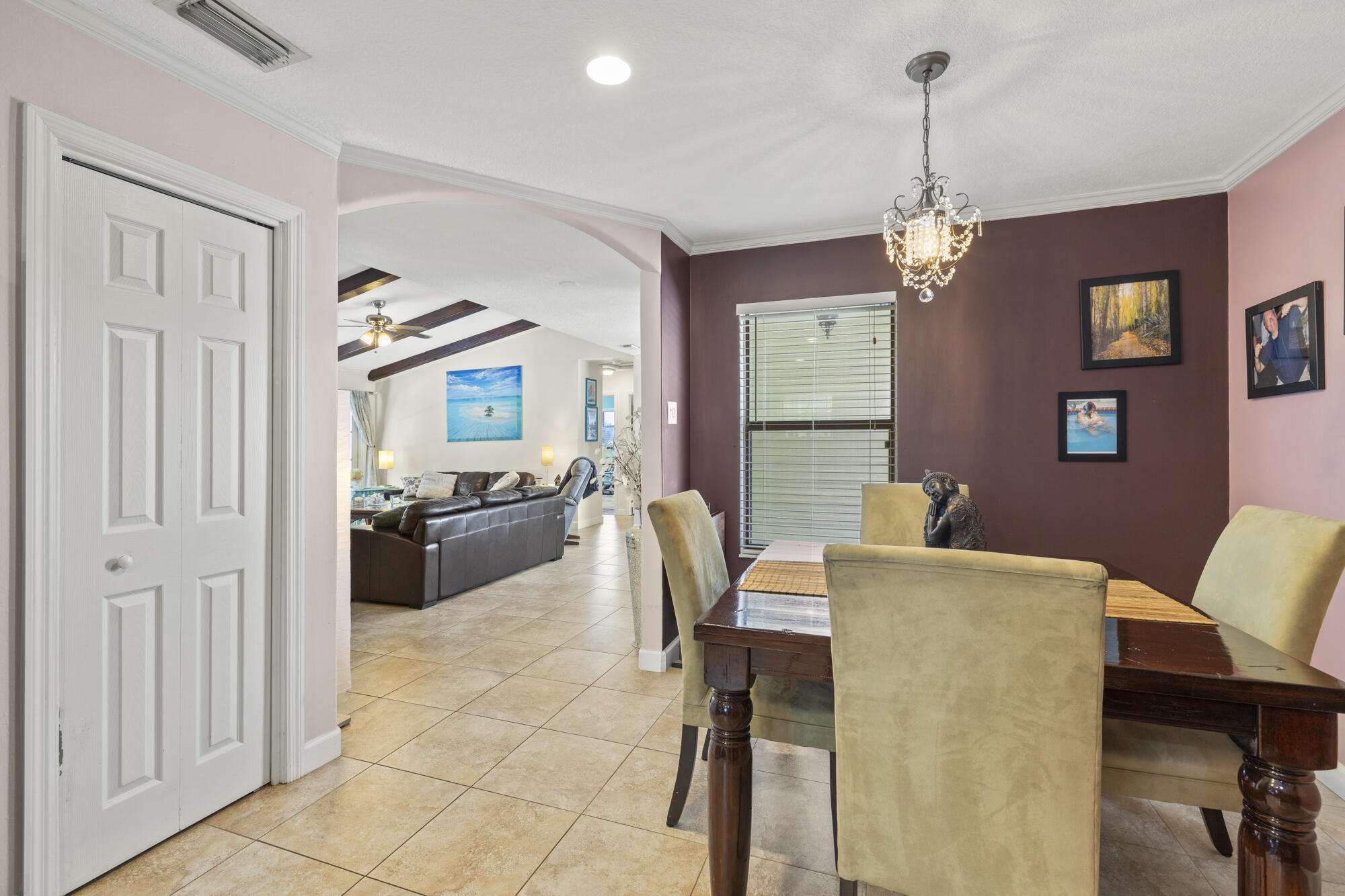 591 Kriss Lane Jupiter, FL 33458 - Photo 9 of 36 a view of a dining room with furniture