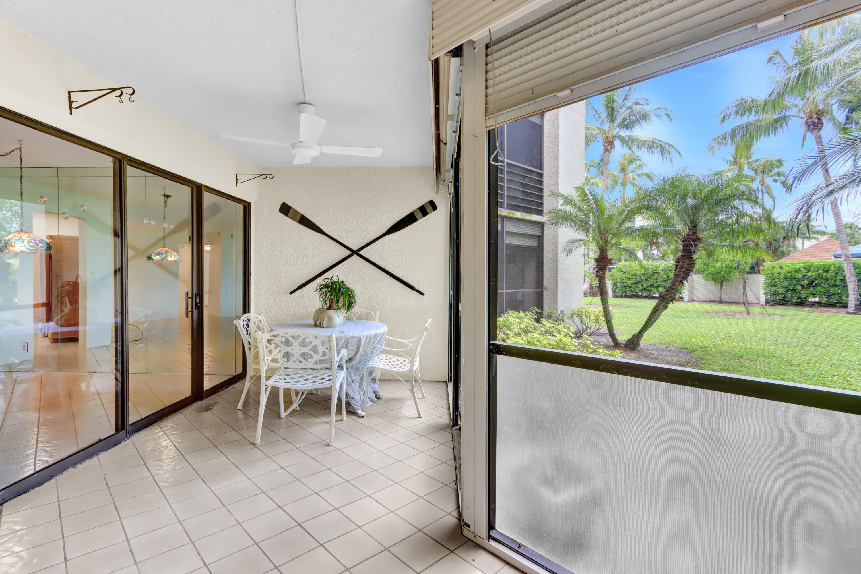 5800 Camino Del Sol, Unit 103 Boca Raton, FL 33433 - Photo 2 of 28 PATIO OVERLOOKING POOL