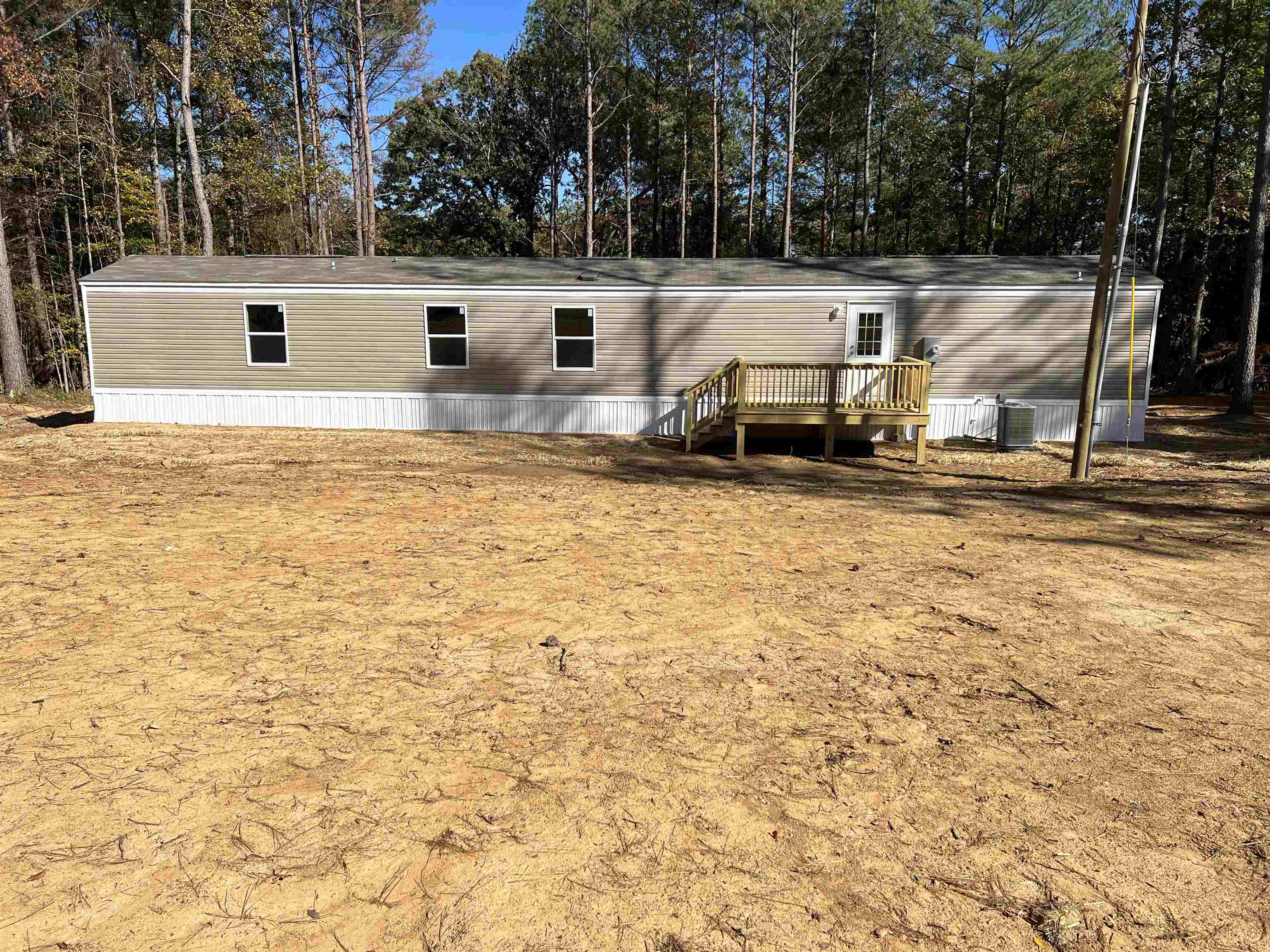 3390 Clifton Road Savannah, TN 38372 - Photo 2 of 12 a view of a house with backyard and trees