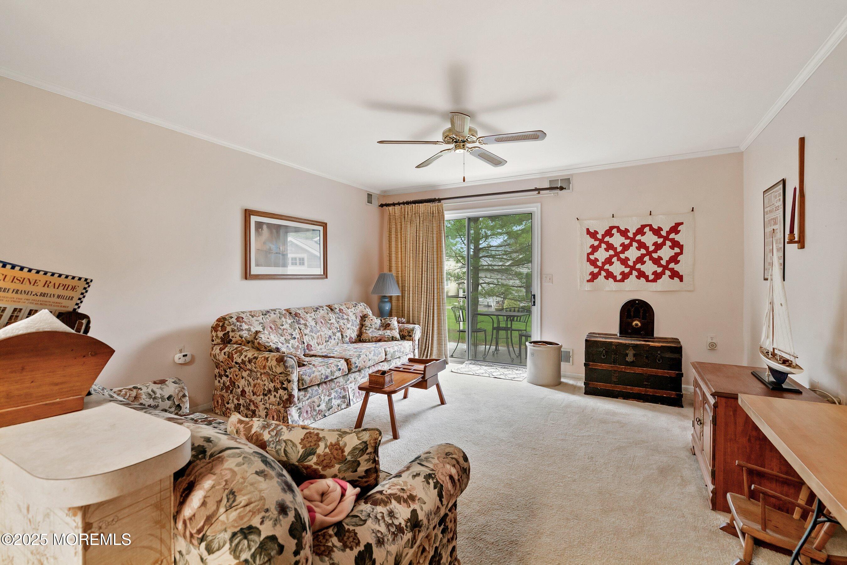 4 Olympus Way Brick, NJ 08724 - Photo 16 of 31 a living room with furniture and a flat screen tv
