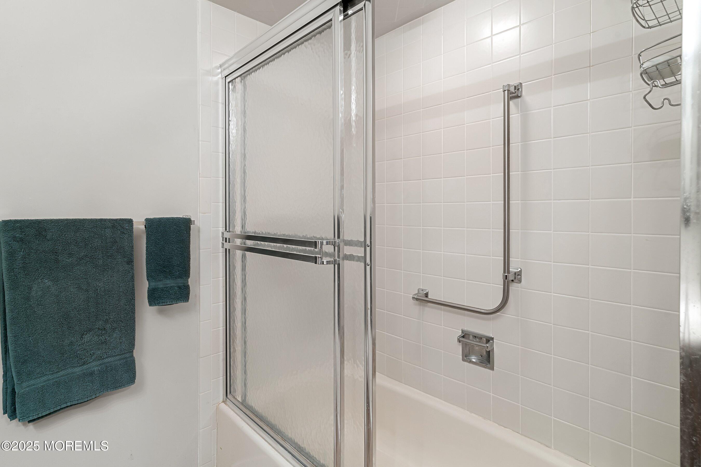 4 Olympus Way Brick, NJ 08724 - Photo 19 of 31 a bathroom with a bathtub and a shower