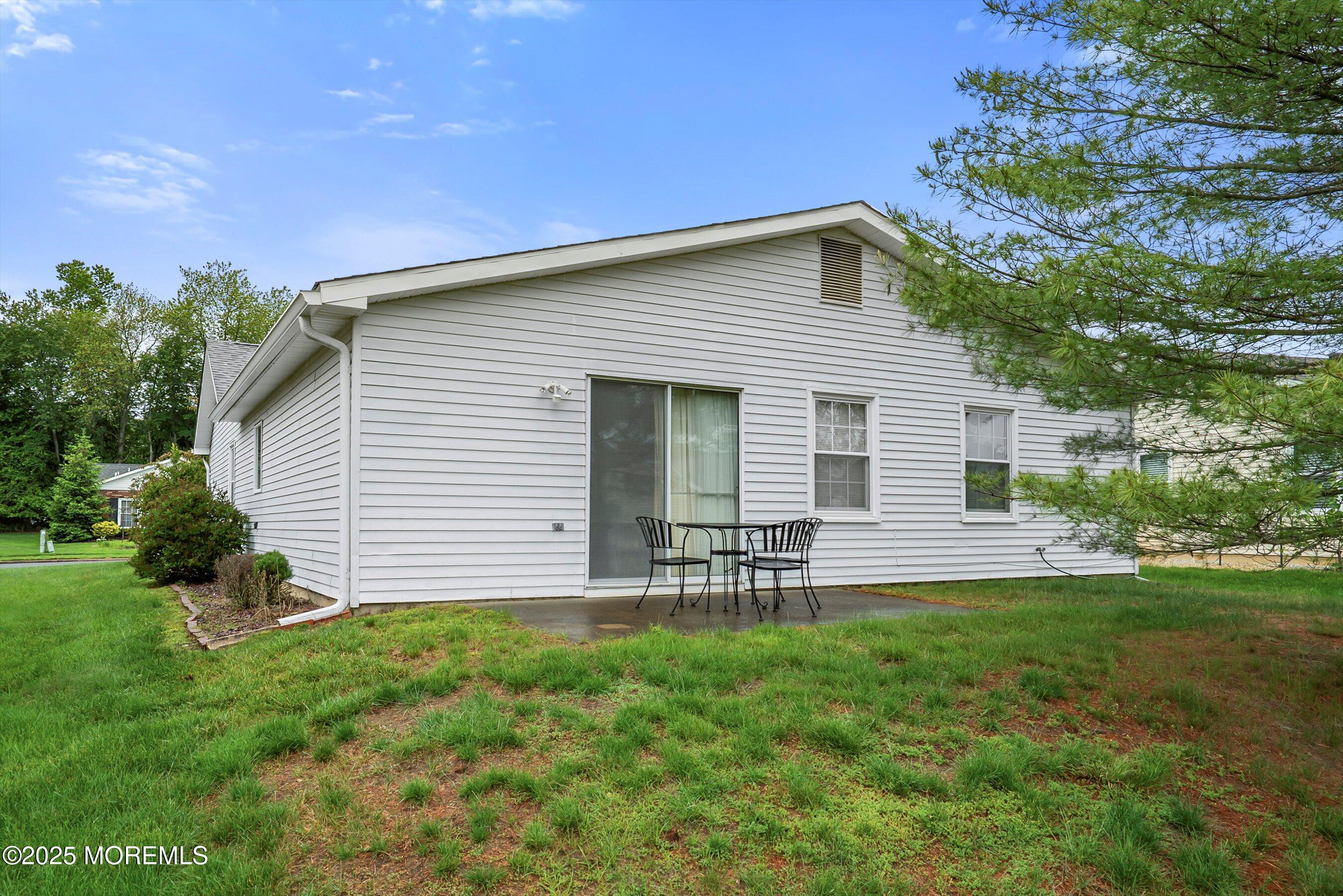 4 Olympus Way Brick, NJ 08724 - Photo 27 of 31 a backyard of a house with table and chairs