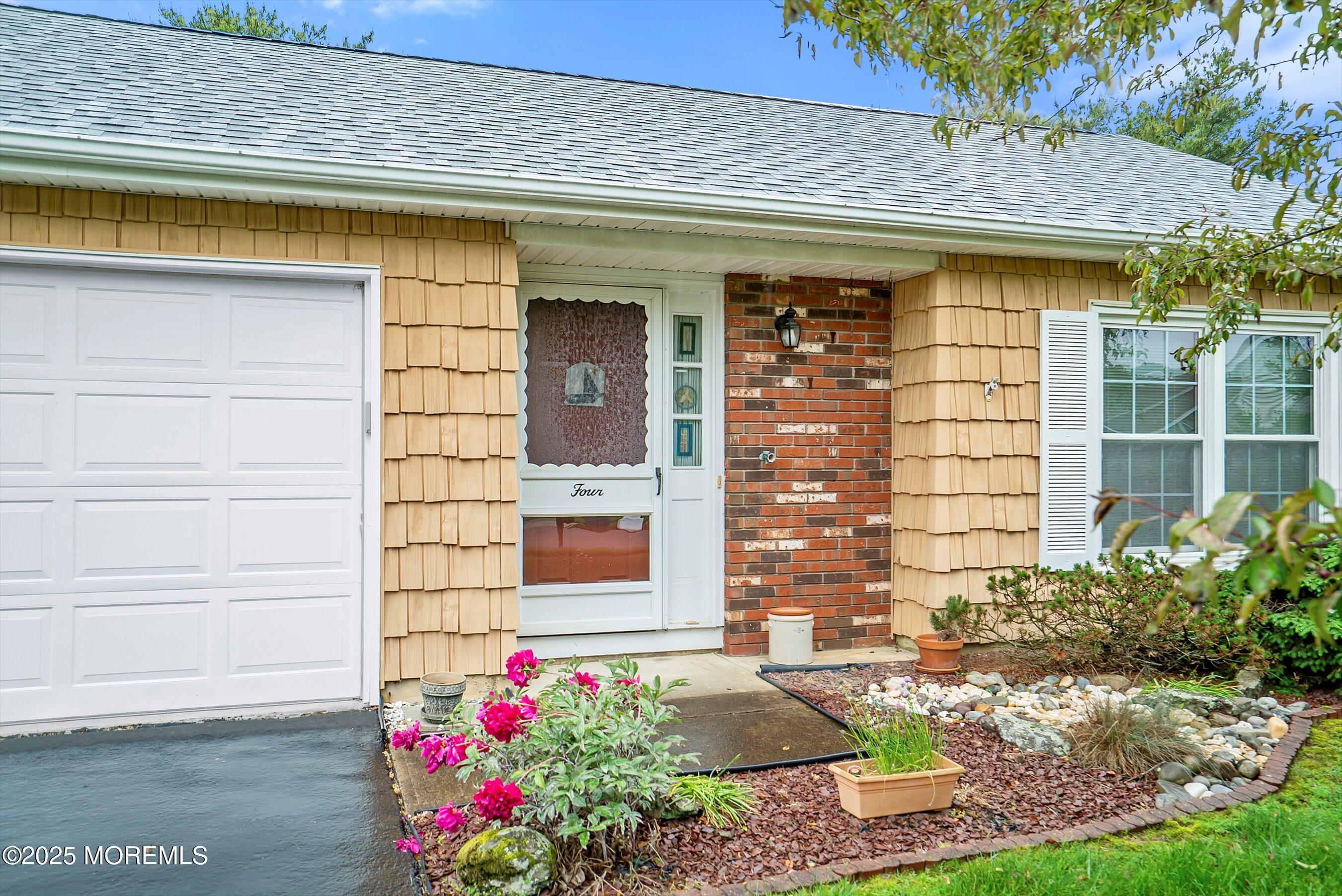 4 Olympus Way Brick, NJ 08724 - Photo 3 of 31 a front view of a house with a yard