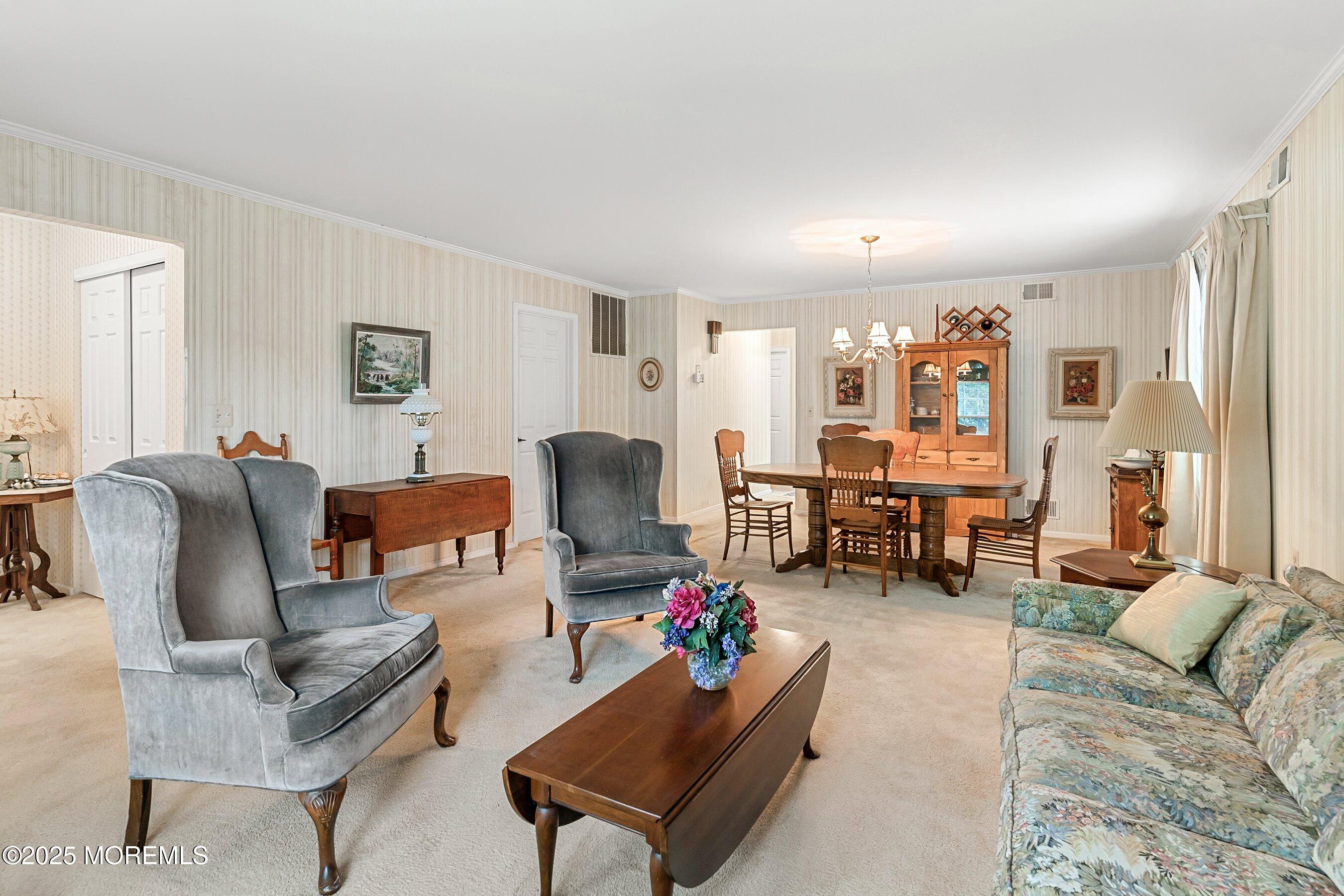 4 Olympus Way Brick, NJ 08724 - Photo 7 of 31 a living room with furniture and a wooden floor