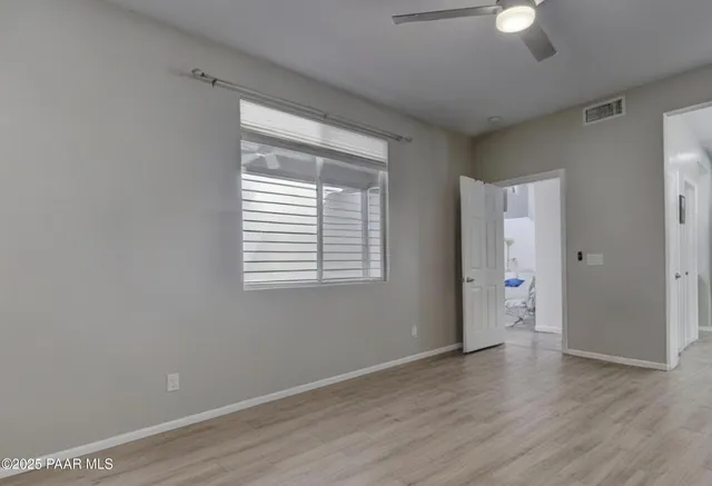 a bedroom with a bed and a lamp