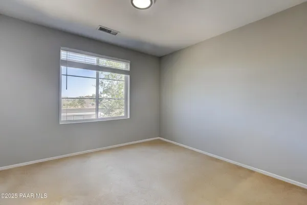 a view of a livingroom with furniture and a window