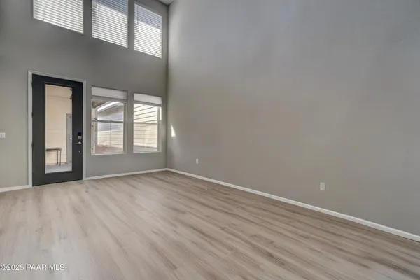 a picture of a room with a white wall and a picture