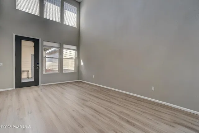 a picture of a room with a white wall and a picture